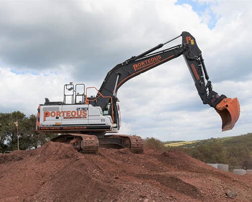 Porteous Branded Groundworks Excavator On A Mound